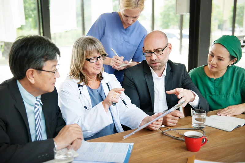 Manager Showcasing Healthcare Administration Skills Through Effective Communication And Leadership In A Medical Facility
