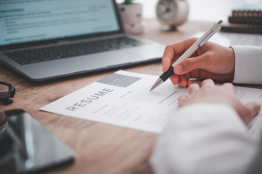 A Recruiter Checking Communication Synonyms In Resume