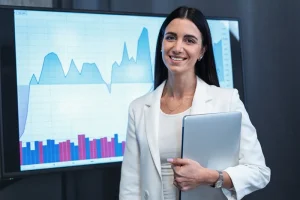 professional standing in front of the analytics dashboard showcasing skills for financial analyst