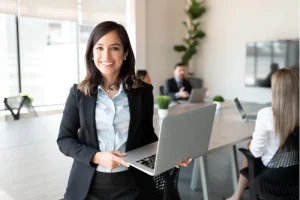 professional woman holding a laptop