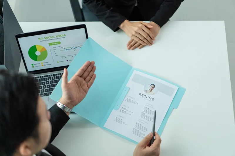 Resume Of A Financial Analyst Being Reviewed By The Hiring Manager