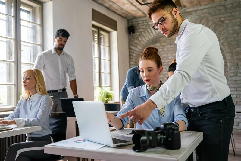 Team Collaborating In An Office Showing How To Improve Focus At Work