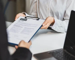 applicant handing out his customer service resume