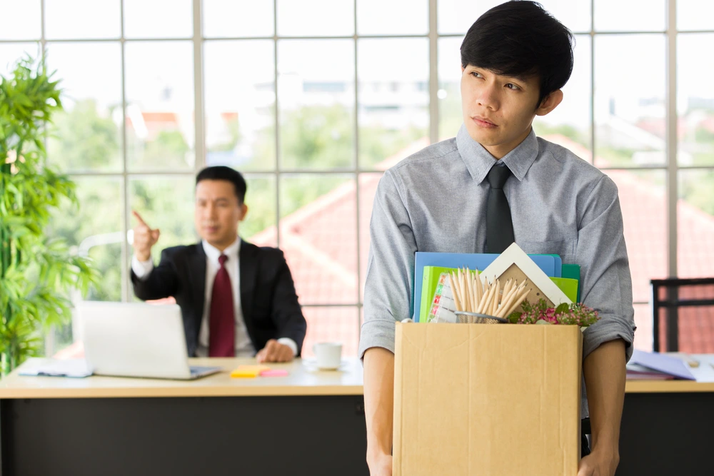 A Sad Employee After Being Fired For Getting Another Job