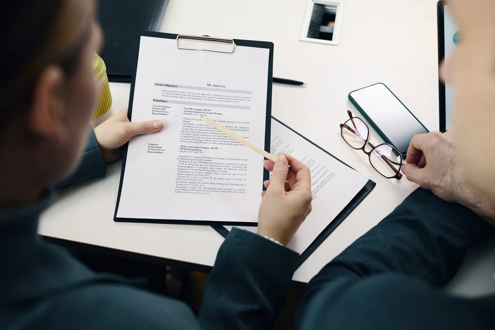 A Reverse Recruiter Collaborating With A Professional Resume Writer