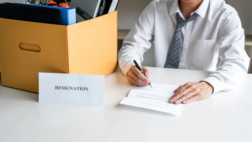 An Employee Packing Up Before Resigning