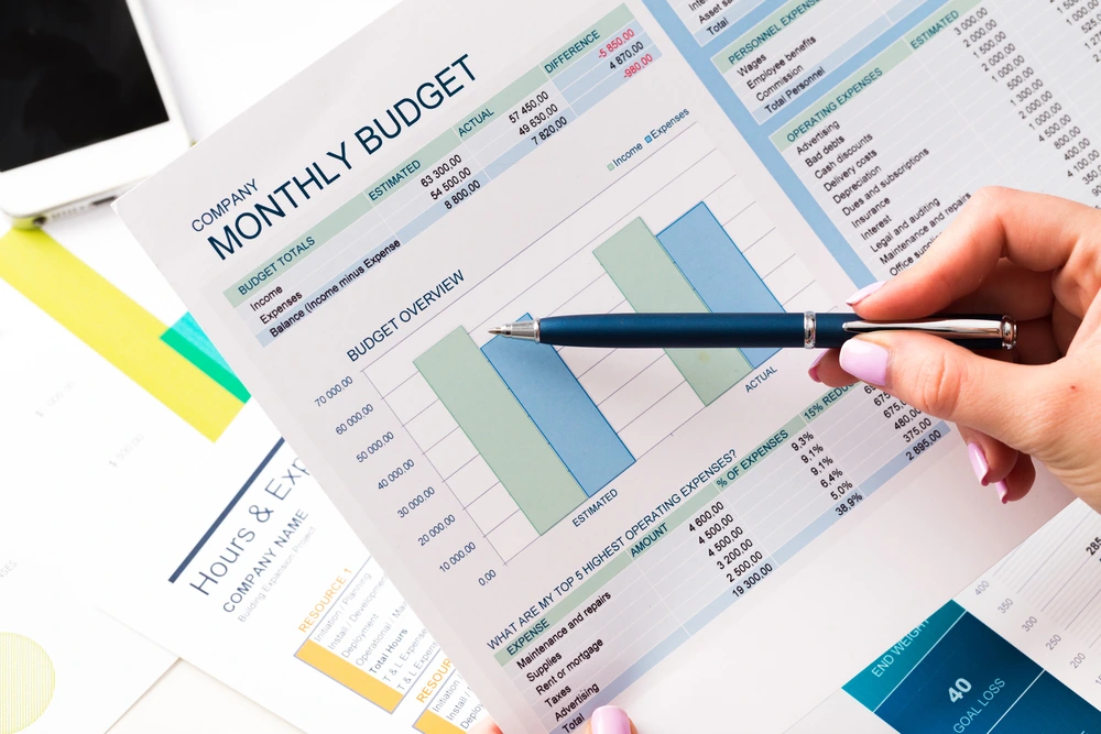 A Realistic Office Scene Showing Professionals Conducting Audits To Prevent Fraud, Ensure Accuracy, And Maintain Compliance With Federal And State Regulations.