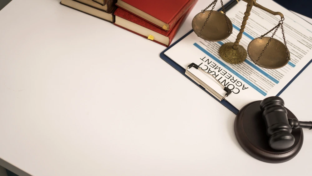 Judge Gavel And Contract Document On The Desk