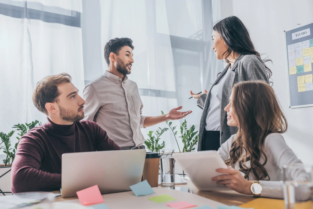 A Group Of Professionals Openly Communicating And Engaging With Each Other