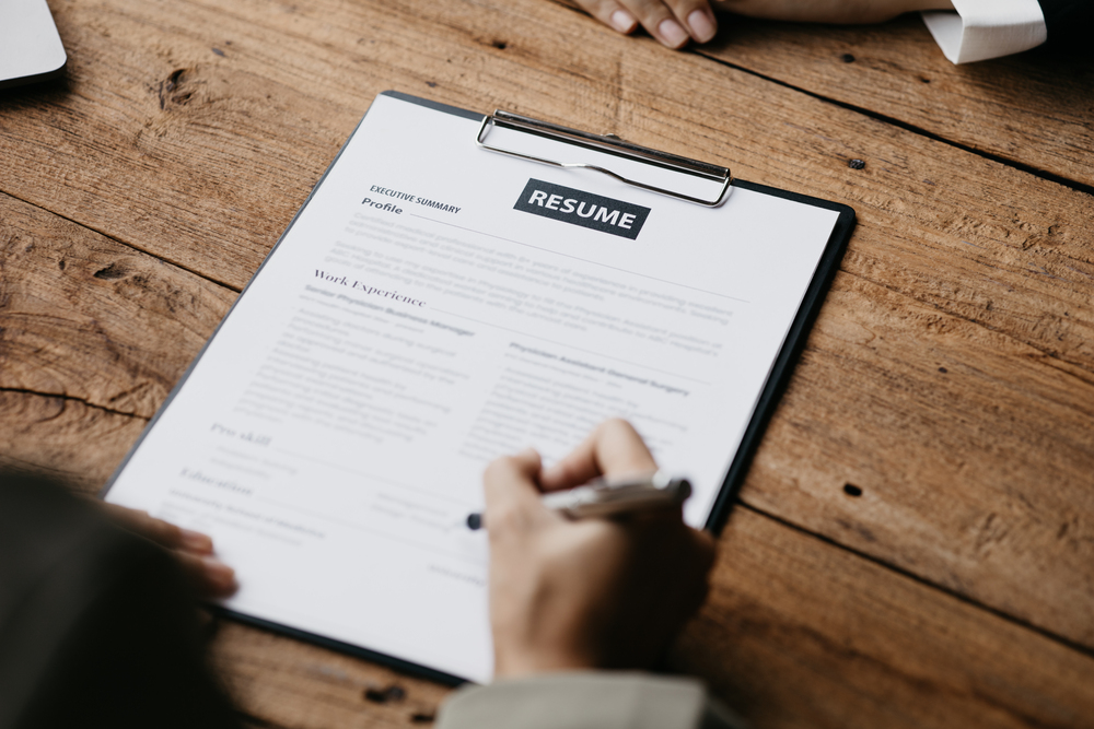 A Person Updating A Resume