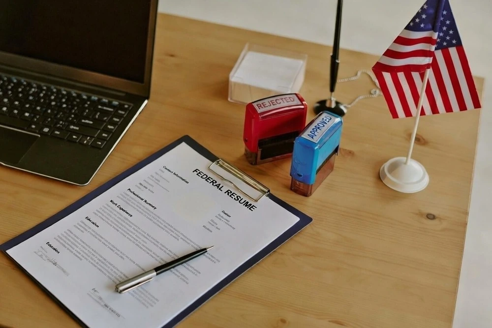 A Federal Resume Document Placed Neatly On A Desk Inside A Government Office Setting