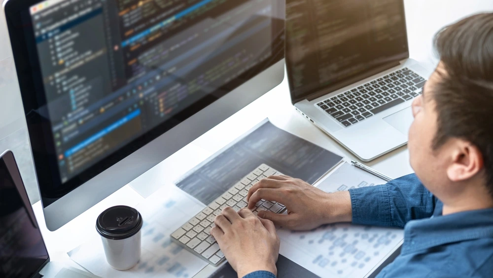 A Professional Working In Programming Website A Software And Coding Technology - Essentials Computer Skills For Resume