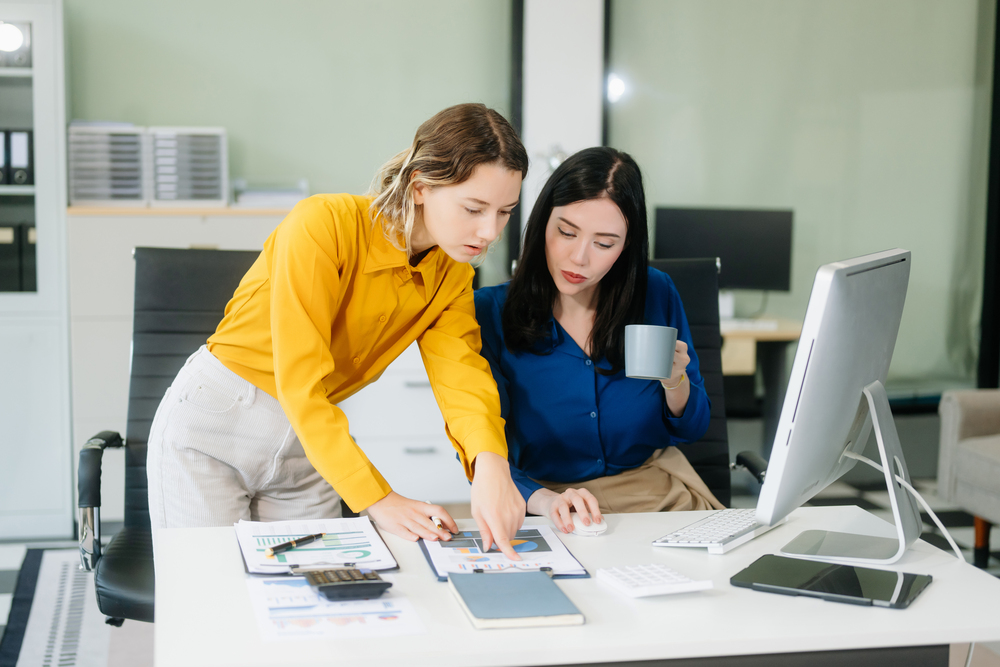 Two Admin Staff Harmoniously Working Together