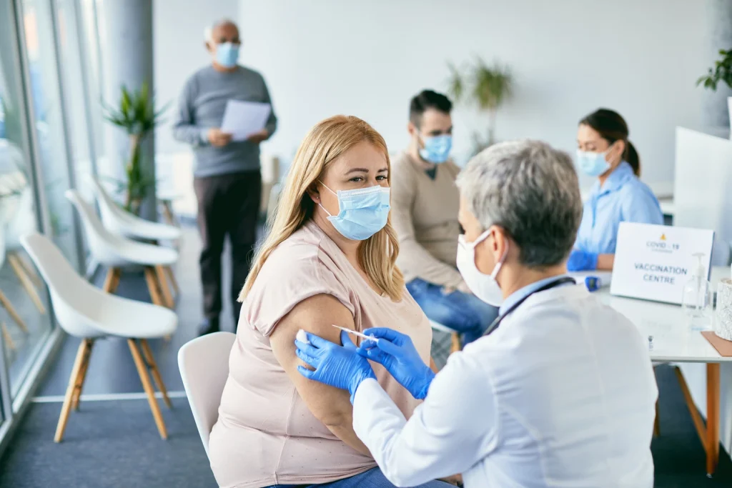 Woman With Face Mask Getting Vaccinated Against Co 2026 03 16 03 30 39 Utc12