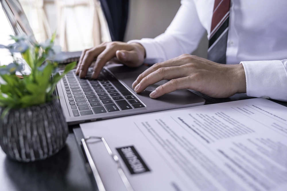 Typing Reason For Leaving Through A Laptop