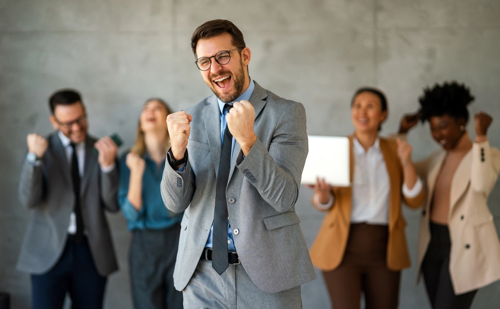 A Successful Group Of Multiethnic Business People Achieving Goals In The Corporate Office