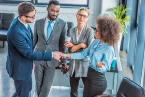 multicultural business people greeting each other