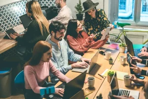 A team of young developers working together during hackathon