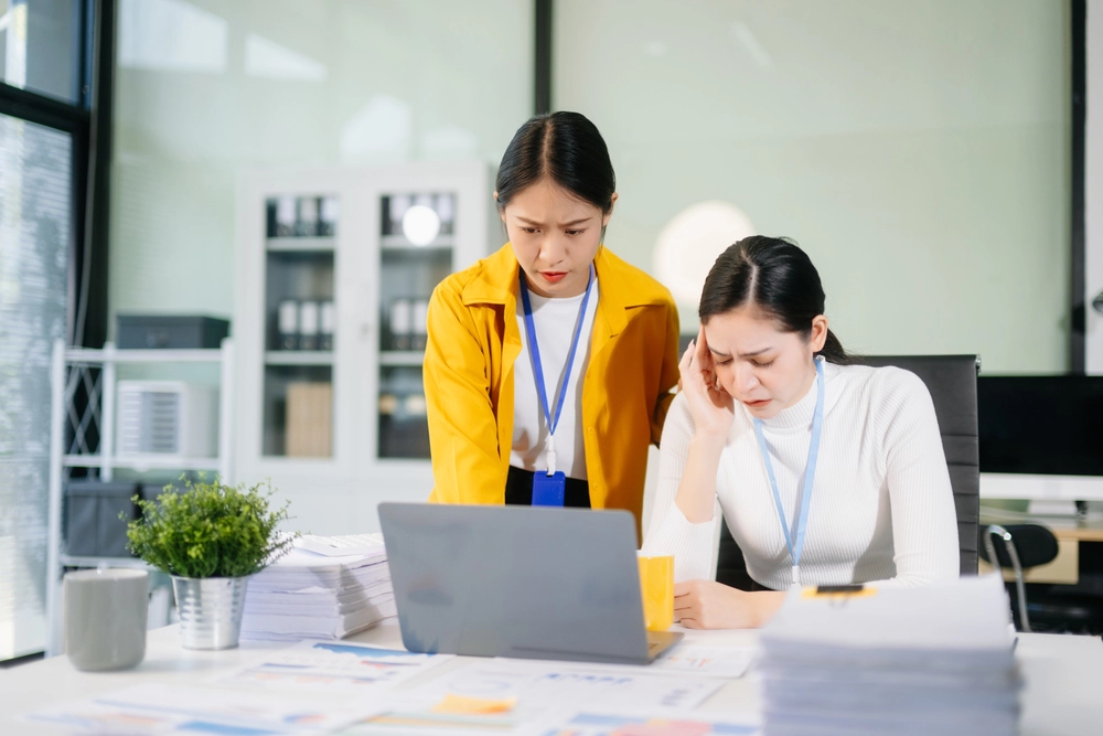An Admin Staff Developing Efficient Solutions To Unexpected Issues.