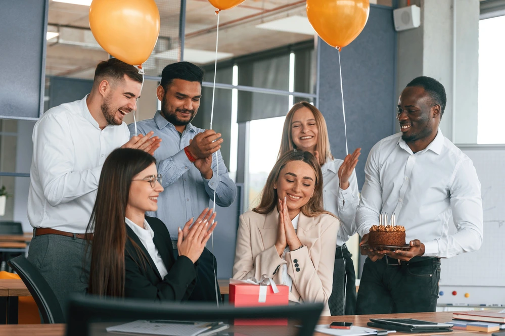 Employees Giving Farewell Message To Colleague