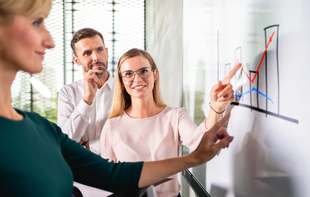 A Sales Associate Presenting Customers' Feedback Report To The Management.