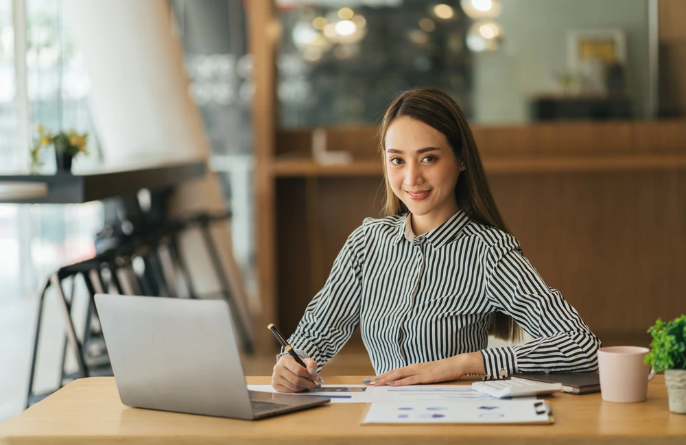 A Professional Preparing For Future Offers By Studying And Preparing A Resume