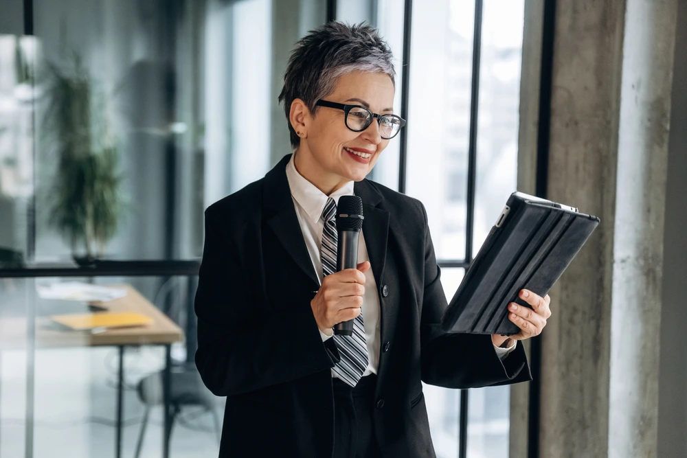 Businesswoman In Formal Attire Holding A Tablet An 2026 04 24 04 31 11 Utc 1