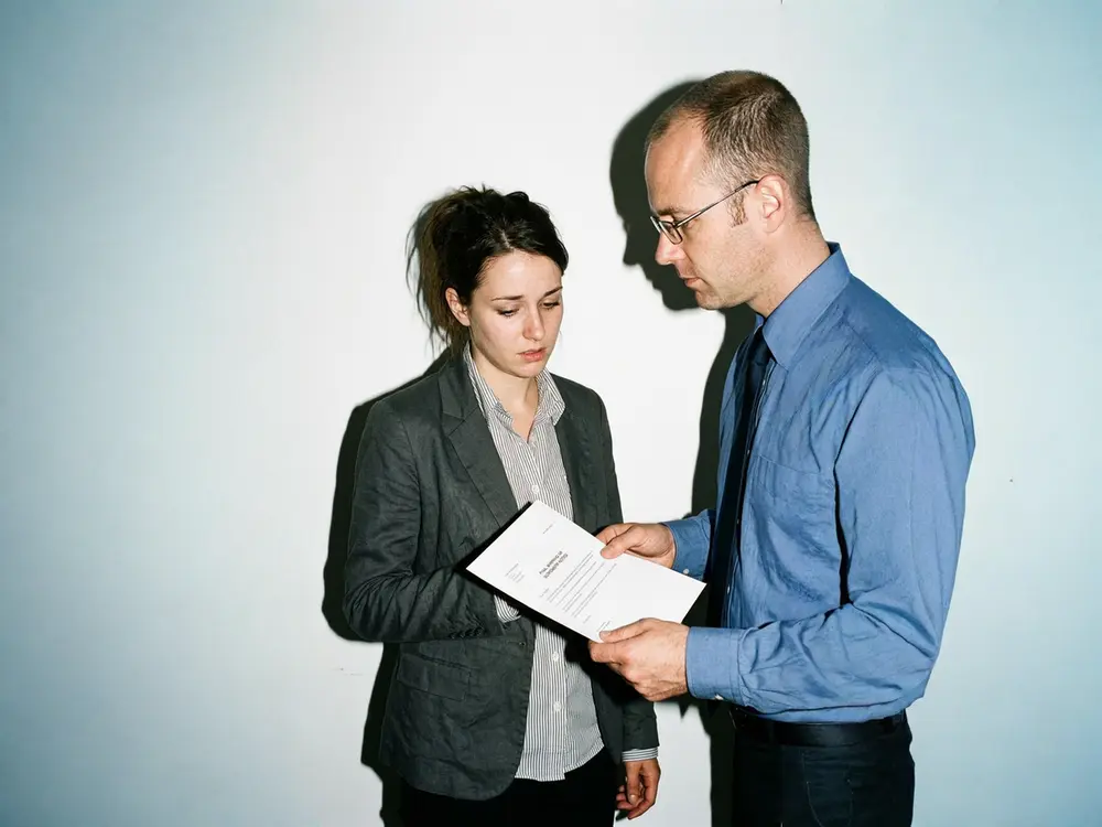 Hr Manager Issuing A Final Warning To A Staff Member, Highlighting Progressive Discipline At Its Last Stage