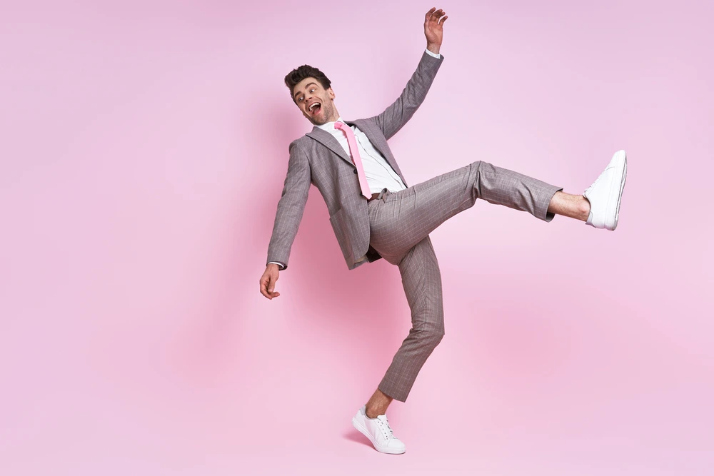 Excited Young Man In Full Suit Moving Against Pink 2026 01 08 02 41 17 Utc 1