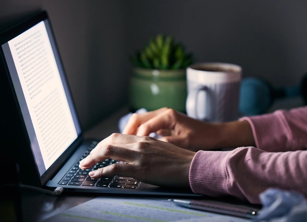A Pair Of Hands Typing A Farewell Message To Colleague.