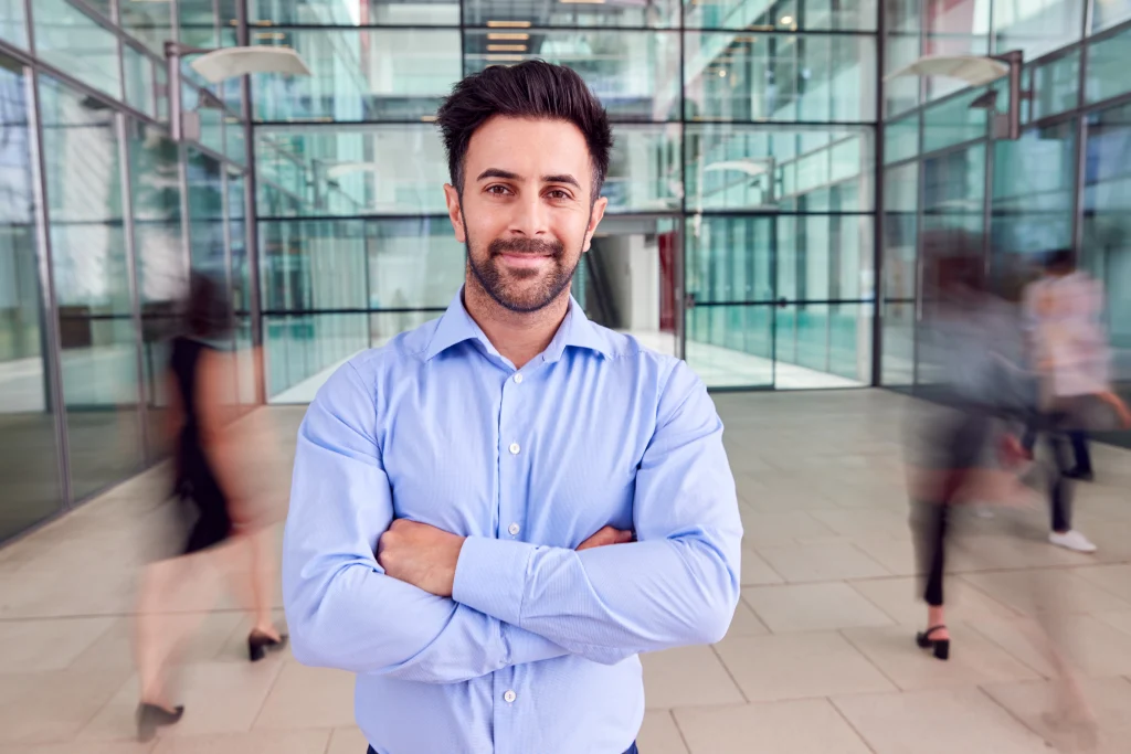 A Portrait Of An Operations Manager In A Busy Workplace.