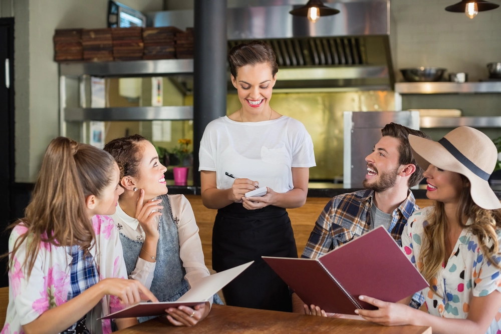A Waitress Effectively Carrying Out Essential Server Duties And Responsibilities