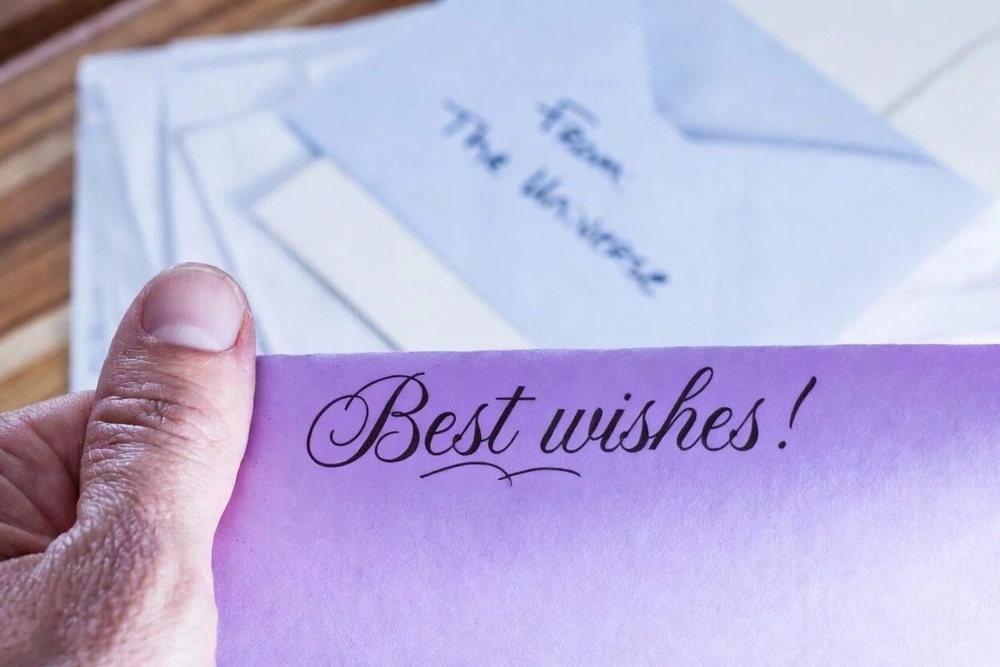 A Farewell Message To Colleague With Best Wishes Written In Cursive Font.