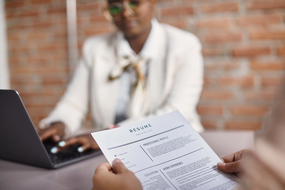 A Hiring Manager Reviewing One Of Many Resume Profile Examples By Role Showing 2026 Formatting And Ats-Friendly Keywords.